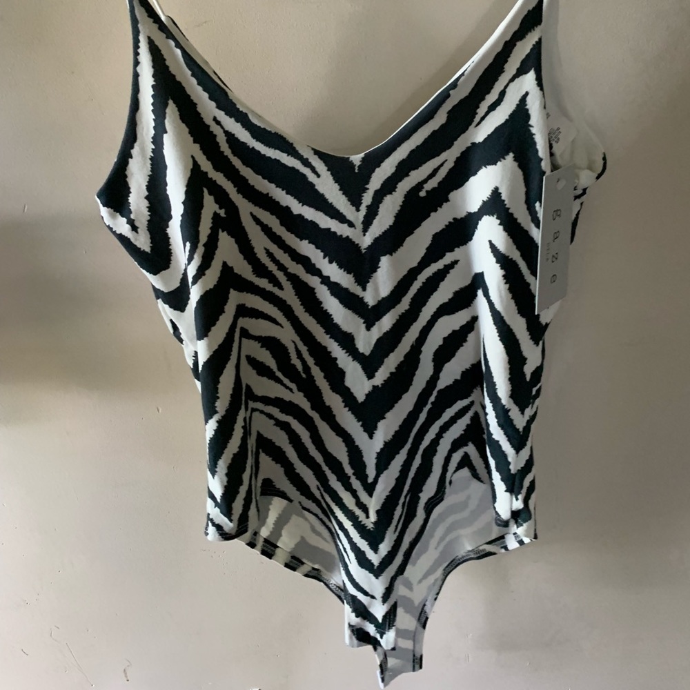 Super cute body suit. Size small. NWT